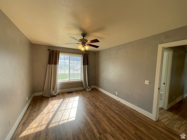 129 N 3rd E, Franklin, ID 83237 - spare room with ceiling fan, wood finished floors, and baseboards