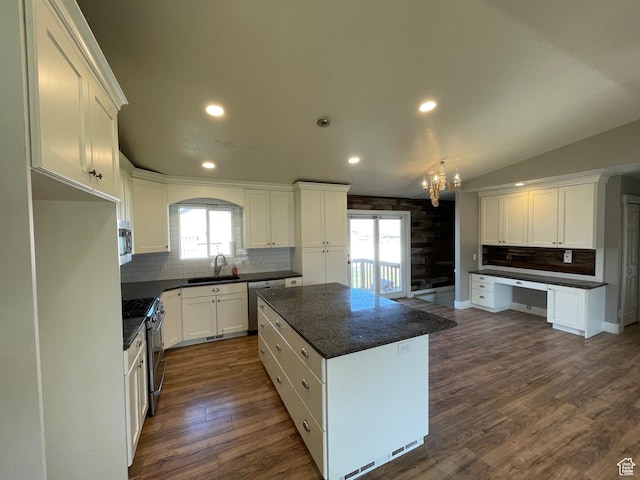 129 N 3rd E, Franklin, ID 83237 - kitchen with a sink, a chandelier, white cabinetry, stainless steel appliances, and decorative backsplash