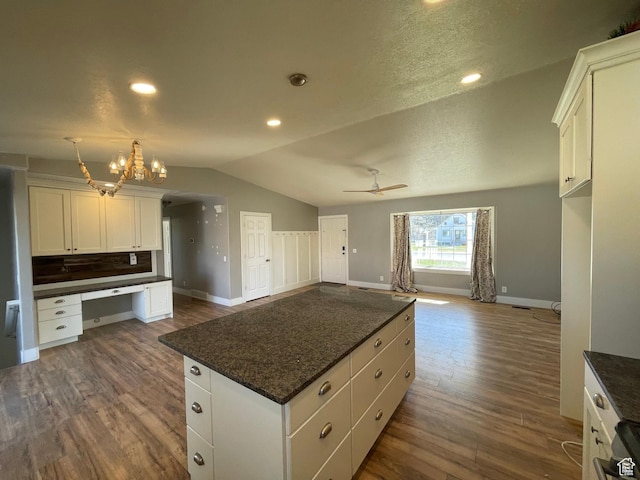129 N 3rd E, Franklin, ID 83237 - kitchen featuring baseboards, open floor plan, dark wood finished floors, white cabinetry, and lofted ceiling