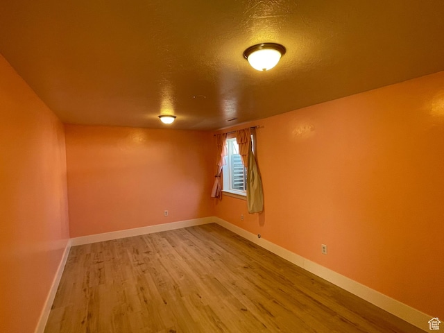 129 N 3rd E, Franklin, ID 83237 - unfurnished room with baseboards, wood finished floors, and a textured ceiling