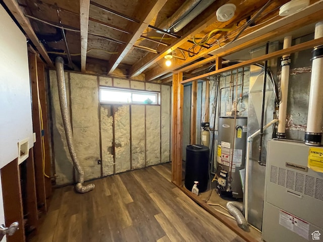 129 N 3rd E, Franklin, ID 83237 - basement featuring wood finished floors, gas water heater, and heating unit