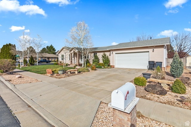 ranch-style house with concrete driveway, a garage, and a residential view