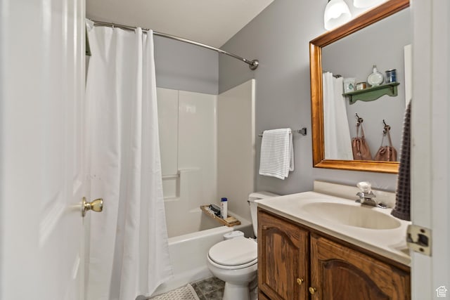 bathroom featuring tile patterned floors, shower / tub combo, vanity, and toilet