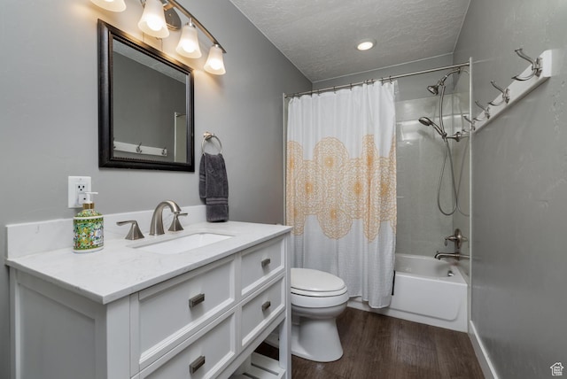 1674 E 1700 S, Naples, UT 84078 - full bathroom featuring toilet, shower / tub combo with curtain, a textured ceiling, vanity, and wood finished floors