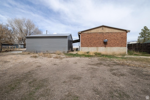 1674 E 1700 S, Naples, UT 84078 - exterior space with fence and brick siding