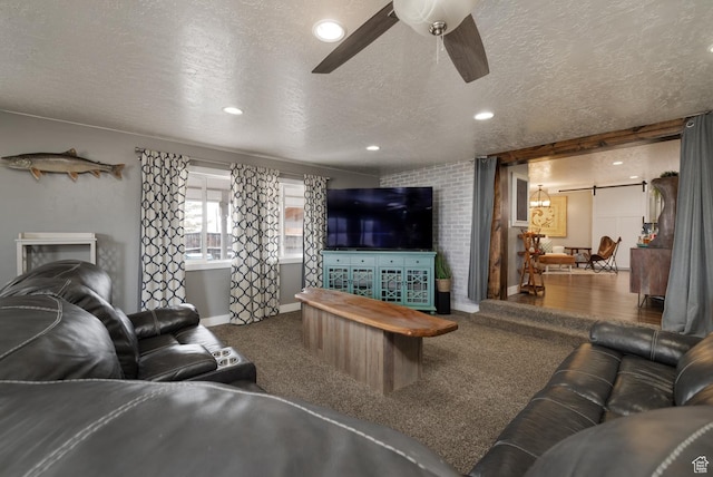 1674 E 1700 S, Naples, UT 84078 - carpeted living area featuring a textured ceiling, a ceiling fan, recessed lighting, a barn door, and baseboards