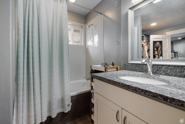 1674 E 1700 S, Naples, UT 84078 - full bathroom with wood finished floors, vanity, and shower / bath combo with shower curtain