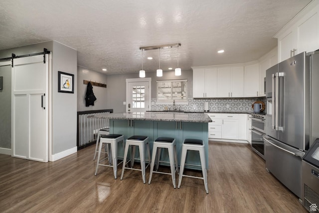 1674 E 1700 S, Naples, UT 84078 - kitchen with white cabinets, dark wood-style flooring, a textured ceiling, and high quality appliances