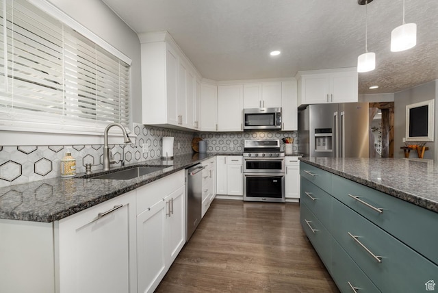 1674 E 1700 S, Naples, UT 84078 - kitchen featuring stainless steel appliances, white cabinetry, a sink, and decorative backsplash