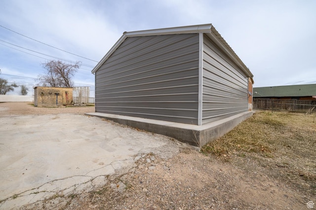 1674 E 1700 S, Naples, UT 84078 - view of side of home with an outbuilding and fence