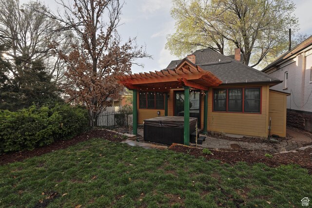 135 W 600 N, Salt Lake City, UT 84103 - rear view of house featuring a pergola, a hot tub, a lawn, a chimney, and fence