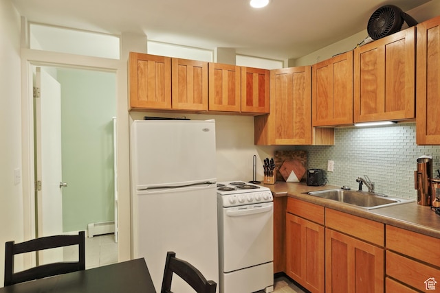 135 W 600 N, Salt Lake City, UT 84103 - kitchen with tasteful backsplash, a sink, white appliances, brown cabinets, and a baseboard heating unit