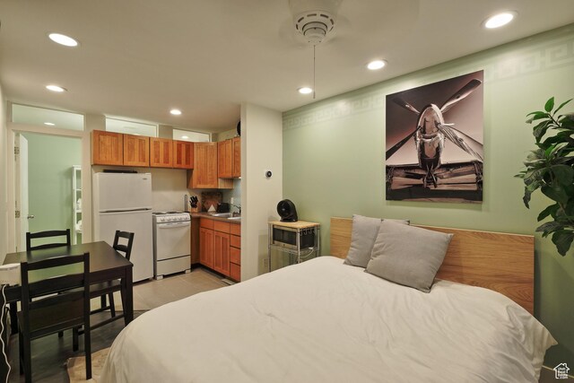 135 W 600 N, Salt Lake City, UT 84103 - bedroom featuring light tile patterned flooring, freestanding refrigerator, a sink, and recessed lighting
