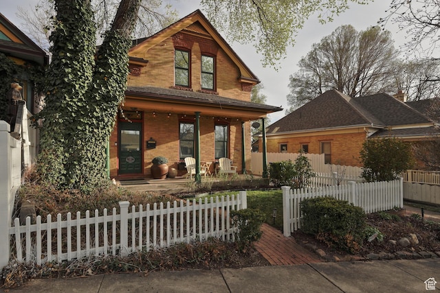 135 W 600 N, Salt Lake City, UT 84103 - view of front of property with brick siding, a porch, and a fenced front yard