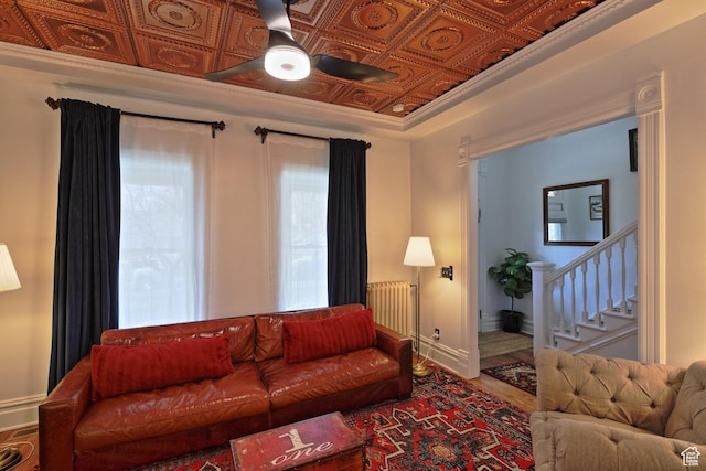 135 W 600 N, Salt Lake City, UT 84103 - living room with a ceiling fan, stairs, an ornate ceiling, radiator, and wood finished floors