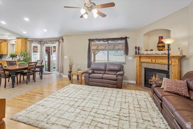 living room with light wood-type flooring, baseboards, recessed lighting, a fireplace, and ceiling fan