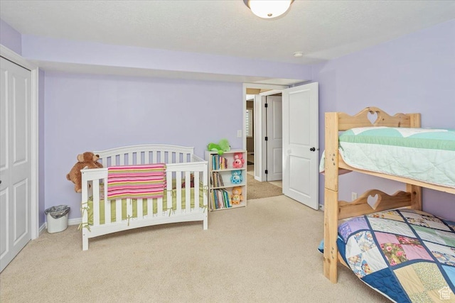 bedroom with carpet flooring and baseboards