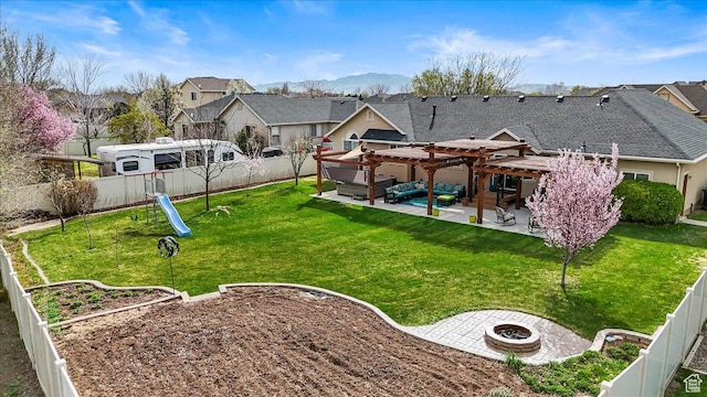 view of yard with a pergola, a fenced backyard, an outdoor fire pit, a patio, and a residential view