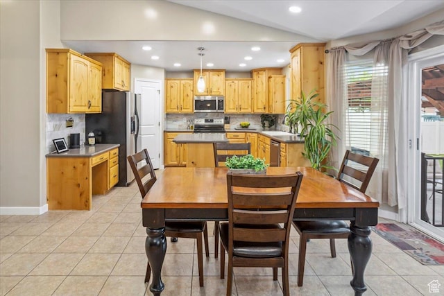 dining room with light tile patterned floors, baseboards, recessed lighting, and lofted ceiling