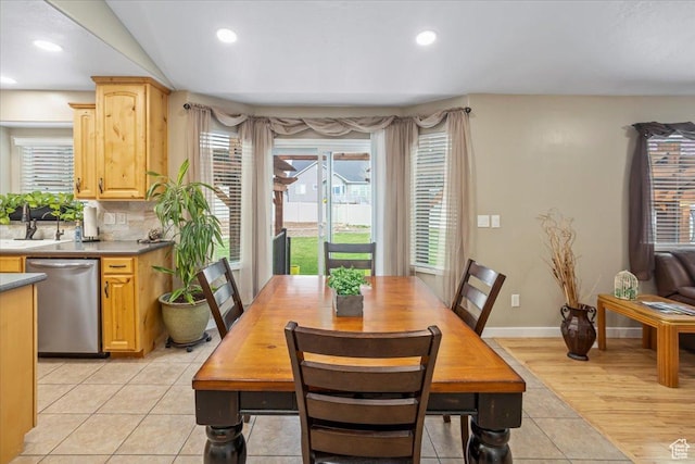 dining room featuring recessed lighting, light tile patterned floors, and baseboards