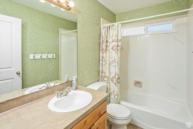 full bathroom featuring toilet, shower / bath combo, vanity, and a textured wall
