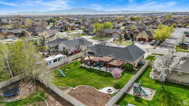 drone / aerial view with a mountain view and a residential view