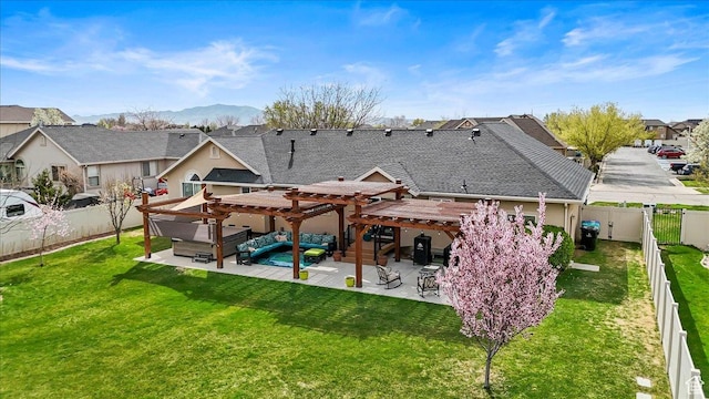 rear view of house with a pergola, a patio area, a fenced backyard, and a yard