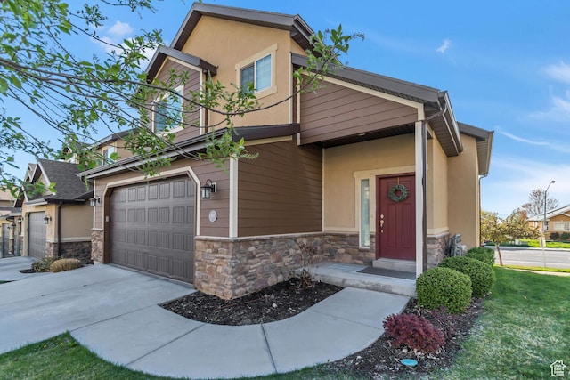 view of front of home with driveway, stucco siding, and stone siding