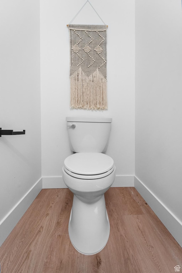 4372 S 900 E Unit 102, Millcreek, UT 84124 - bathroom with baseboards, wood finished floors, and toilet
