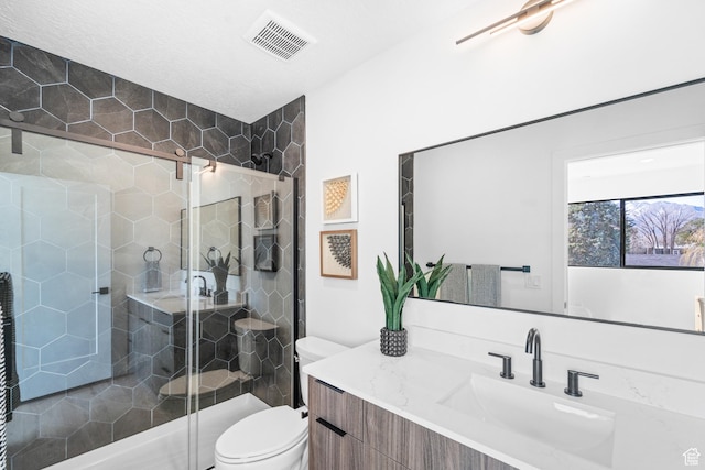4372 S 900 E Unit 102, Millcreek, UT 84124 - bathroom with a stall shower, toilet, and vanity