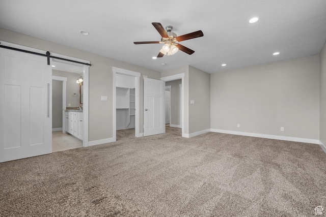 229 S 950 W, Springville, UT 84663 - unfurnished bedroom with light carpet, a barn door, recessed lighting, a spacious closet, and connected bathroom
