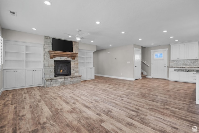 229 S 950 W, Springville, UT 84663 - unfurnished living room with ceiling fan, light wood-style floors, a fireplace, recessed lighting, and stairs