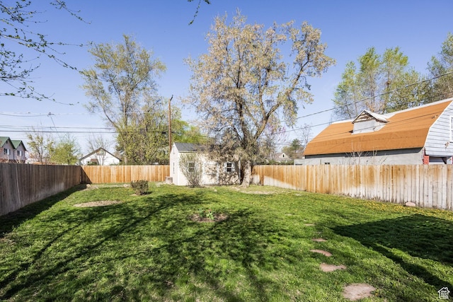 3752 S Mccall St E, South Salt Lake, UT 84115 - view of yard with a shed, a fenced backyard, and an outdoor structure