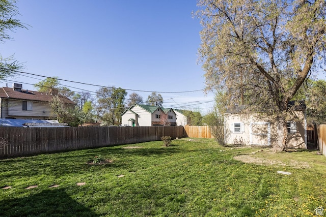 3752 S Mccall St E, South Salt Lake, UT 84115 - view of yard featuring a fenced backyard and an outdoor structure