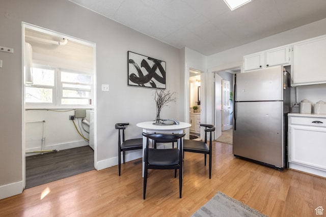 3752 S Mccall St E, South Salt Lake, UT 84115 - dining area with light wood finished floors and baseboards