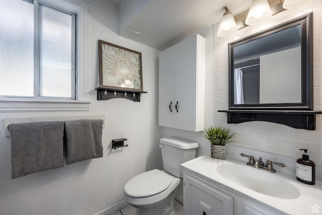 3752 S Mccall St E, South Salt Lake, UT 84115 - bathroom with vanity, baseboards, toilet, and decorative backsplash