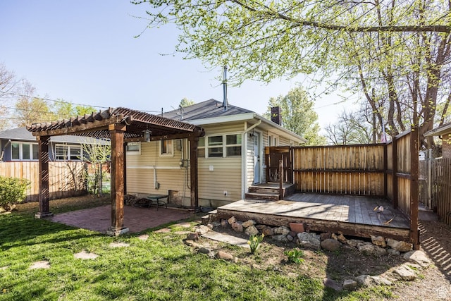 3752 S Mccall St E, South Salt Lake, UT 84115 - back of property featuring a pergola, a fenced backyard, a lawn, a patio, and a chimney