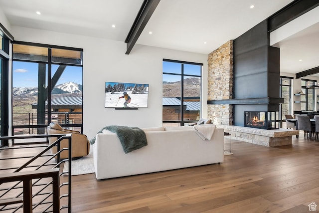 1526 W Orion Way, Heber City, UT 84032 - living room featuring beam ceiling, wood finished floors, and a stone fireplace