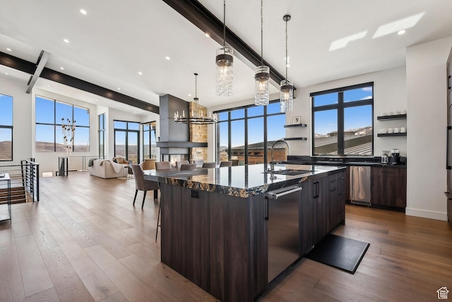 1526 W Orion Way, Heber City, UT 84032 - kitchen featuring open shelves, a sink, a kitchen bar, dark wood-type flooring, and a center island with sink