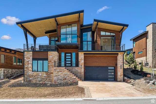 1526 W Orion Way, Heber City, UT 84032 - modern home featuring driveway, stone siding, an attached garage, and a balcony