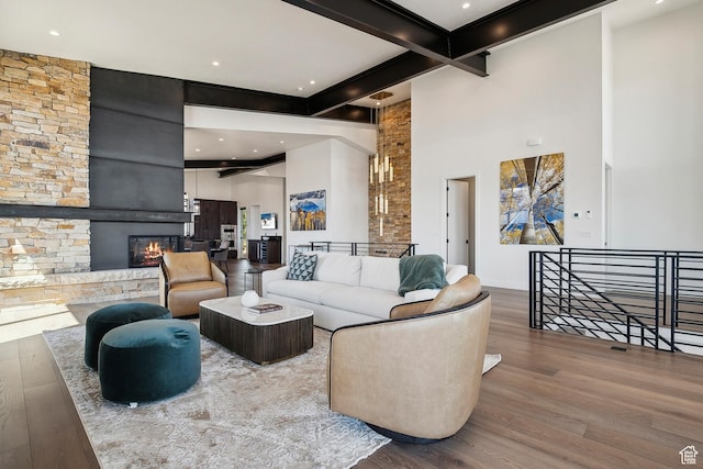 1526 W Orion Way, Heber City, UT 84032 - living area with a fireplace, wood finished floors, beamed ceiling, and a high ceiling