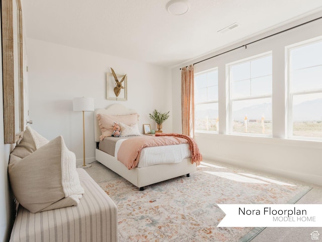 bedroom featuring baseboards, visible vents, and carpet floors
