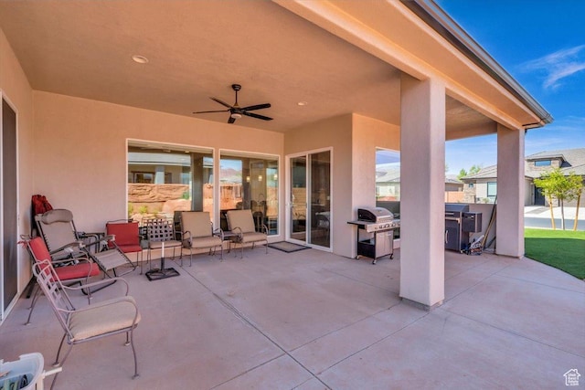 view of patio featuring a grill and ceiling fan