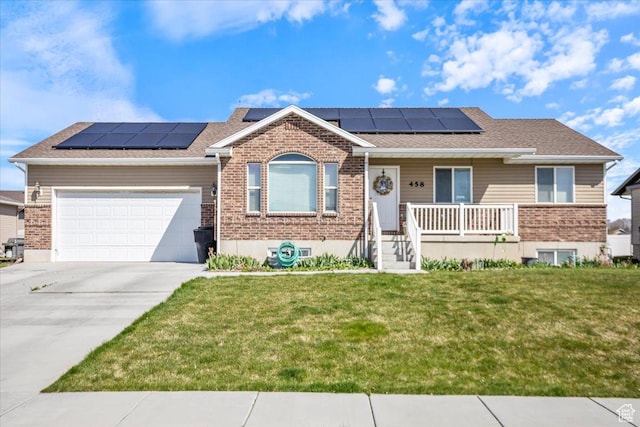 ranch-style house with covered porch, a front yard, and brick siding