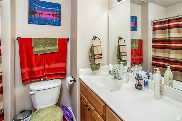 full bathroom featuring toilet, vanity, and a shower with curtain