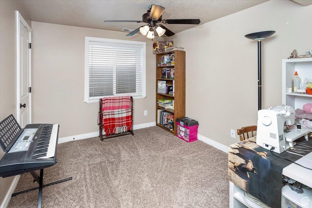 interior space featuring visible vents, baseboards, ceiling fan, a textured ceiling, and carpet floors