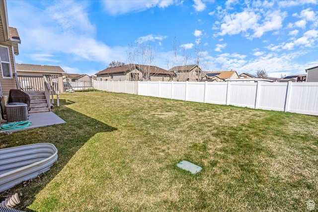 view of yard featuring a residential view and fence