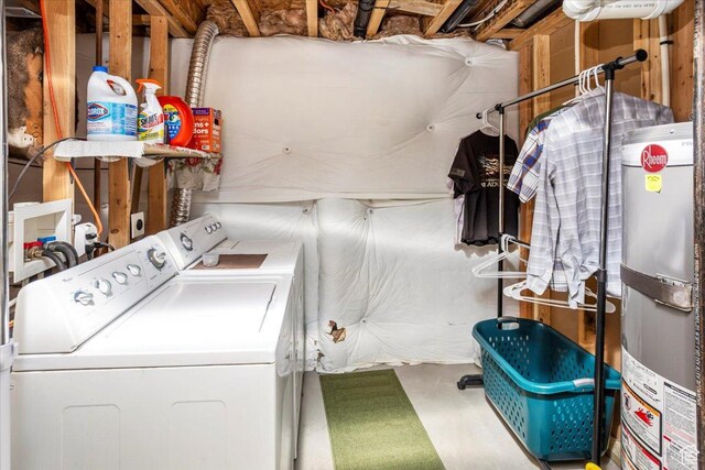laundry room with water heater, washer and clothes dryer, and laundry area