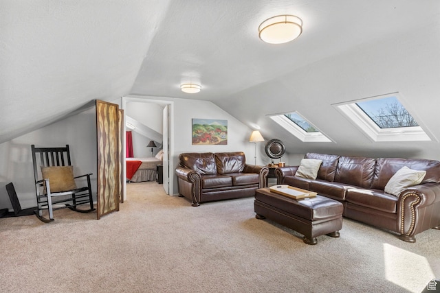 carpeted living room featuring lofted ceiling with skylight