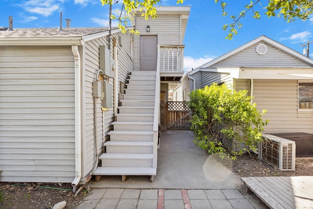 exterior space featuring stairway and a gate